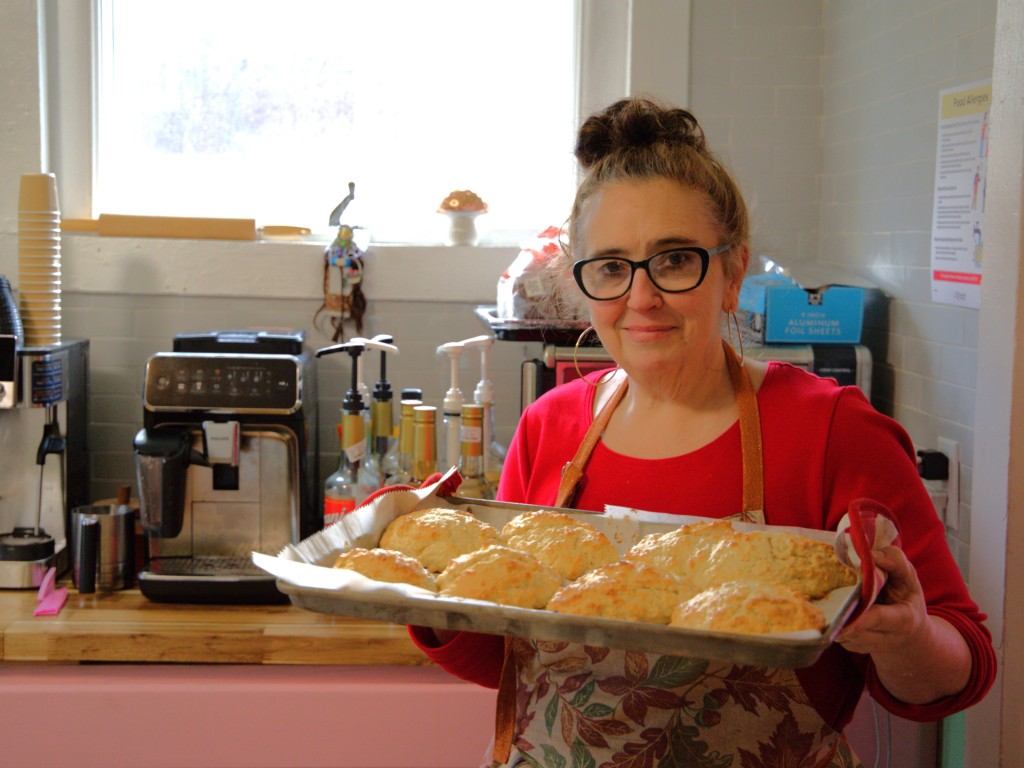 Photo by J.T. Stone
Amy Heffron, owner of the newly opened Morning Moon Coffee and Bakery in Newfield, holds a tray of freshly baked almond scones on Nov. 11.